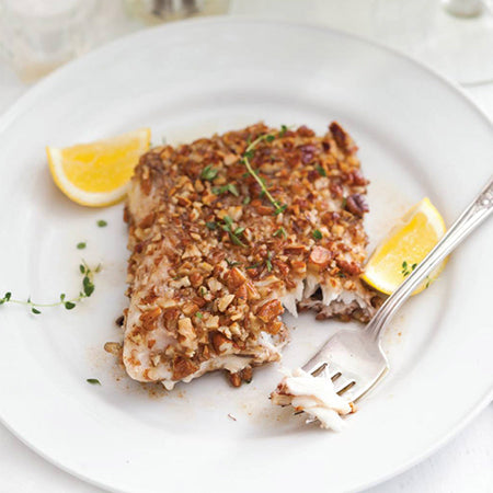 Pecan-crusted fish filets with lemon sauce